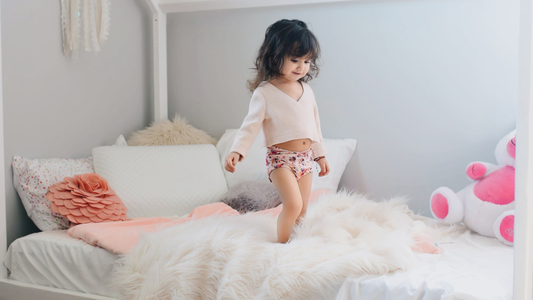 When should you transition to a toddler bed?